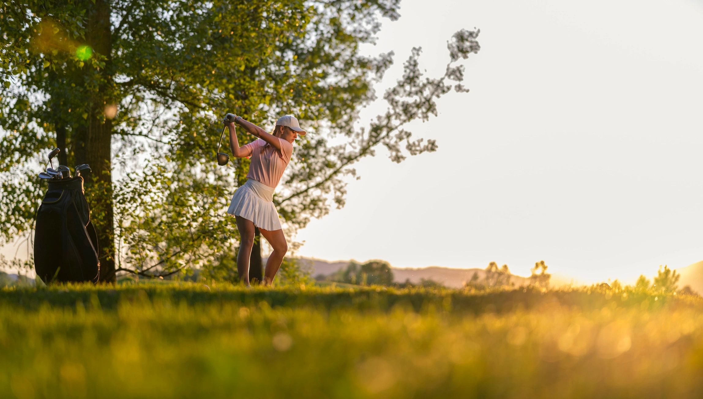 Golfer on course in casual apparel